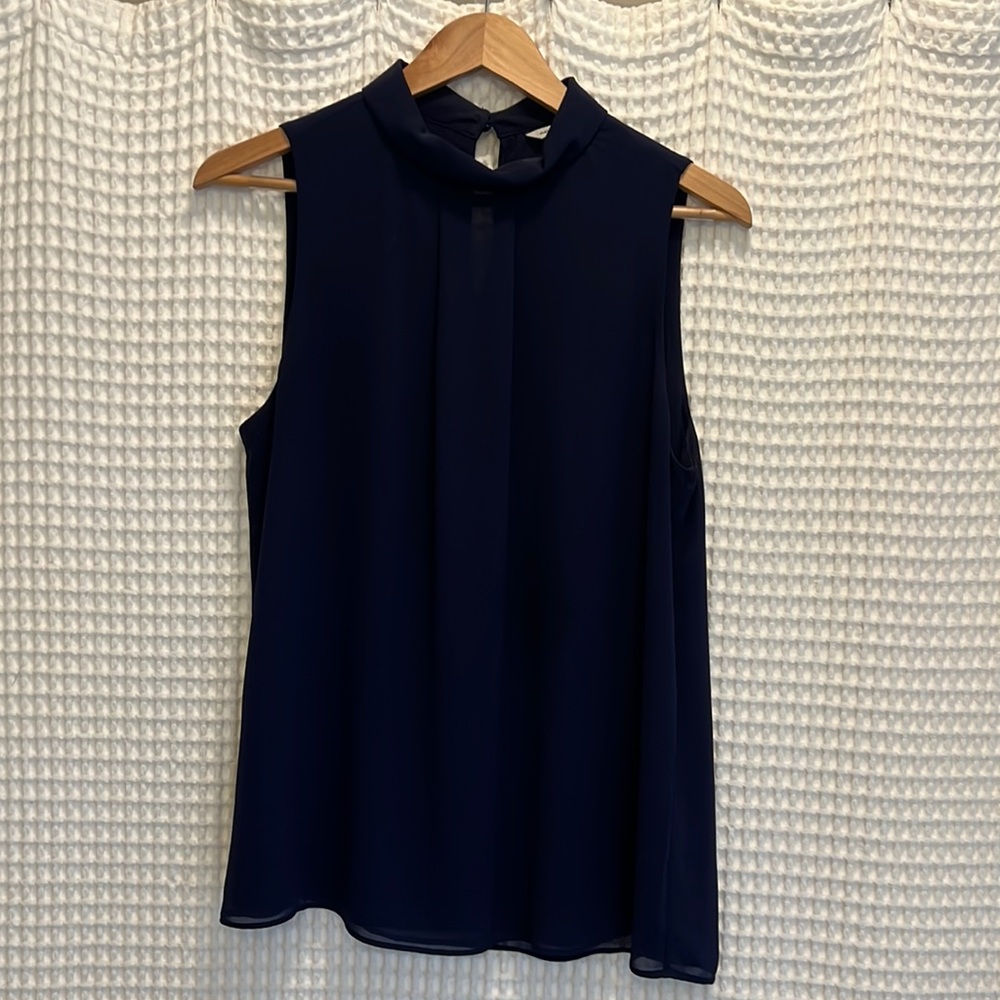 Flirty navy chiffon sleeveless top. NWOT.